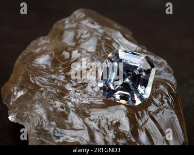 Sparkling asscher cut diamond on a rough smoked quartz Stock Photo