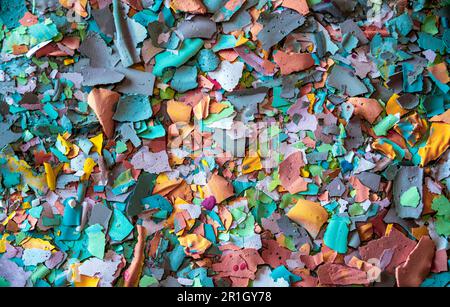 Multicolored texture created with pieces of dry tempera with pastel colors ideal for backgrounds and graphic resources Stock Photo