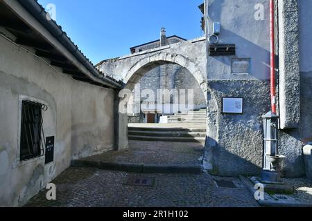 A narrow street among the old houses of Rivisondoli, a small town in the mountains of central Italy. Stock Photo