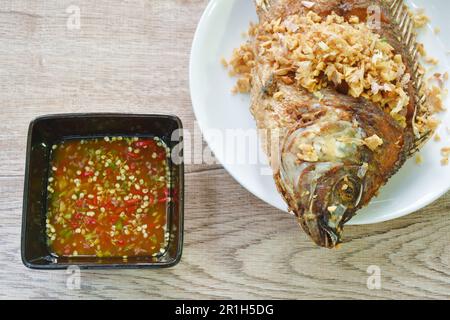 fried mango fish on plate dipping spicy sauce herb sauce in cup Stock Photo
