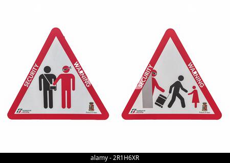 The security warning sign in Milan central railway station Stock Photo