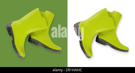 Green rubber boots. Tool equipment for gardening or vegetable garden and plant care. Also useful for rain. Top view isolated on white and green backgr Stock Photo