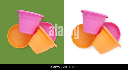 Gardening equipment, plastic colorful garden pots with plates, top view isolated on white and green background. Banner for planting work or product sh Stock Photo