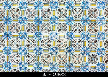 pattern of typical old decorated tiles at a wall in Portugal, influenced by arabesque design Stock Photo