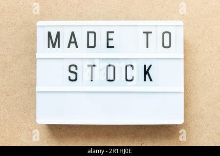 Lightbox with word made to stock on wood background Stock Photo