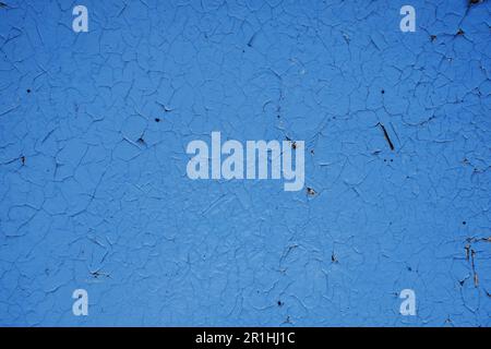 Aged blue wall background. Antique blue brick wall. Old blue painted wall texture. Distressed blue plastered surface. Stock Photo