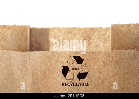 Paper bag with recycling symbol on white background. Eco friendly package Stock Photo