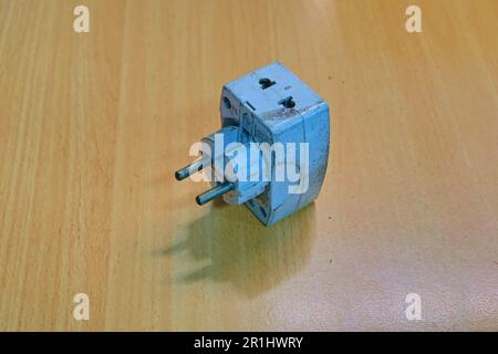 Jakarta Indonesia, May 14, 2023, old electrical connector adapter on a wooden table Stock Photo