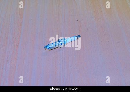 Close up of platinum spark plugs on a wooden table Stock Photo
