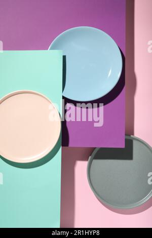 Abstract composition made of plates on color background, flat lay Stock Photo