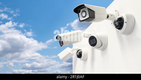 Surveillance cameras on a background of blue sky. Perimeter security. High quality photo Stock Photo