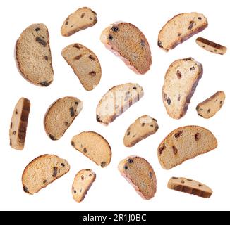 Falling sweet hard chuck crackers with raisins on white background Stock Photo