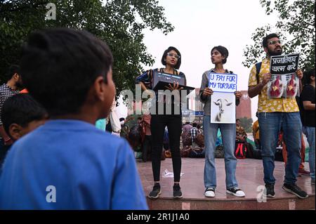 New Delhi, Delhi, India. 14th May, 2023. Activists from Vegan India Movement hold placards during a protest ''The Forgotten Mothers'' against animal cruelty and urging people to chose Vegan diet on the occasion of Mothers Day in New Delhi, India on May 14, 2023. (Credit Image: © Kabir Jhangiani/ZUMA Press Wire) EDITORIAL USAGE ONLY! Not for Commercial USAGE! Credit: ZUMA Press, Inc./Alamy Live News Stock Photo