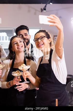Students in cookery class taking selfie after cooking - friends and social media concept Stock Photo