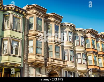 A series of classic colorful painted Victorian homes line a street on Telegraph Hill in San Francisco. Stock Photo