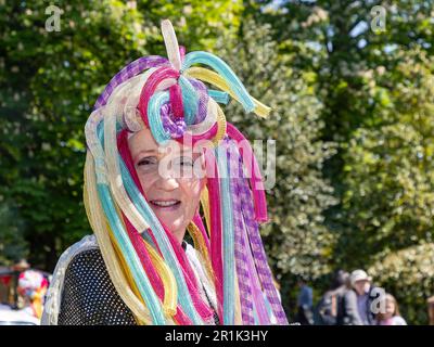 Lymm May Queen and Rose Queen 2023. Lady from Lymm Jubilee WI wears a colourful headdress Stock Photo