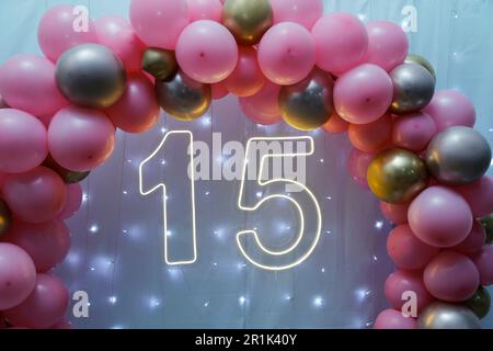 number fifteen with lights at 15th birthday party - front view - light party Stock Photo