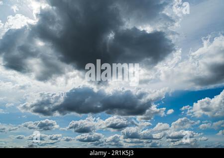 Rainy cloud on blue sky, stormy sky nature background in rainy weather. Stock Photo