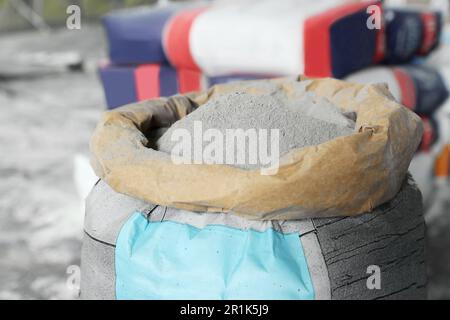 Cement powder in bag indoors, closeup view Stock Photo