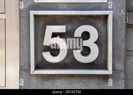 The plate with the number 53 is made of metal. Design and construction concept Stock Photo