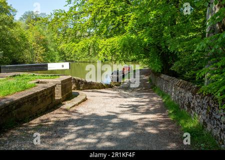 British waterway maintenance canal narrowboat moored on the Peak Forest canal at Marple Cheshire England Stock Photo