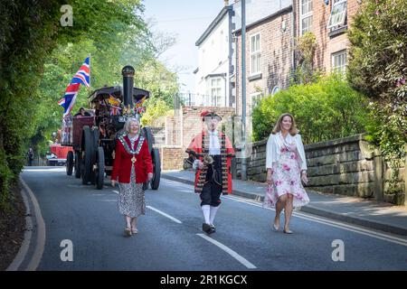 Lymm May Queen and Rose Queen 2023. Town Crier AJ Powell with Committee members leads the way followed by an Aveling & Porter traction Engine Stock Photo