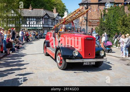 Lymm May Queen and Rose Queen 2023. Joseph Crosfield (Dennis) fire engine passes through the village Stock Photo