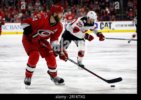 https://l450v.alamy.com/450v/2r1ktxg/carolina-hurricanes-jaccob-slavin-74-controls-to-puck-against-the-new-jersey-devils-during-the-third-period-of-game-5-of-an-nhl-hockey-stanley-cup-second-round-playoff-series-in-raleigh-nc-thursday-may-11-2023-ap-photokarl-b-deblaker-2r1ktxg.jpg