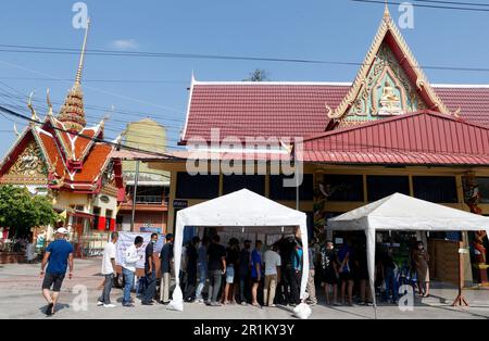 Voters line up before a polling site opens to cast their ballots in ...