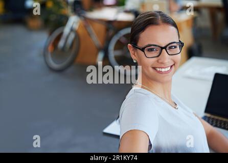 Developing tomorrows tech today. a designer at their workstation in an office. Stock Photo