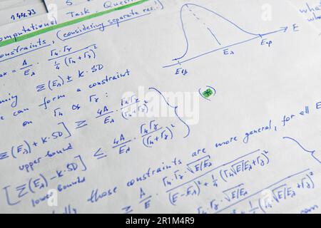 Paper with written mathematical calculations as background, closeup ...