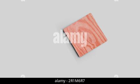 Empty square cork coaster, isolated on grey background. Perfect as food display. Stock Photo