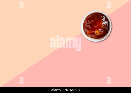 Close up view asian tapioca porridge with white ceramic isolated on pink background. Stock Photo