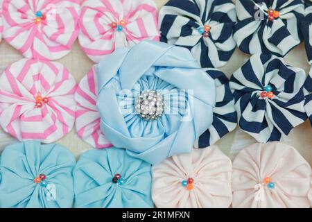 The yo-yo handicraft is made up of several small bundles of clothes that, sewn together, give rise to flowers of different colors. interiors in rio de Stock Photo