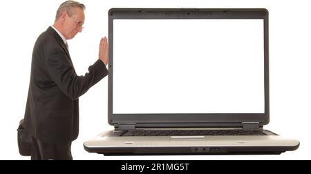 Laptop computer with a businessman on the side pushing Stock Photo