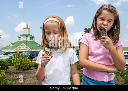 Sevierville Tennessee,Tanger Outlet Mall,girl girls kids children sisters siblings eat eating ice cream, Stock Photo