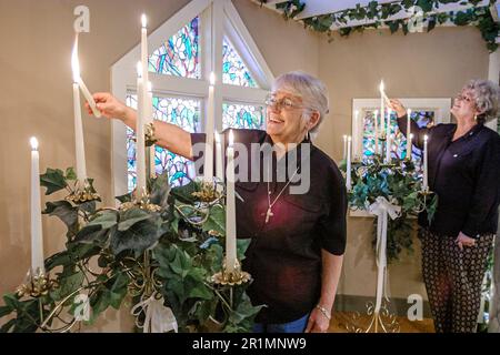 Sevierville Tennessee,English Garden Wedding Chapel,inside interior senior woman female women lights lighting candles, Stock Photo