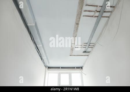 Ceiling with wires prepared for renovation in room Stock Photo