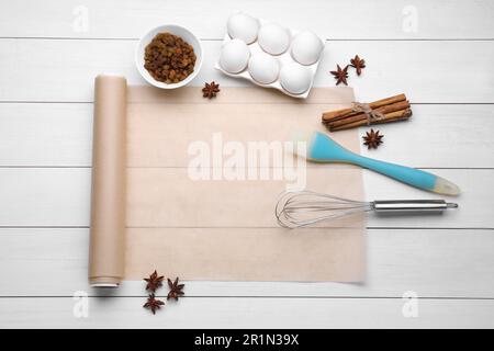 https://l450v.alamy.com/450v/2r1n39x/baking-parchment-paper-and-different-ingredients-on-white-wooden-table-flat-lay-space-for-text-2r1n39x.jpg