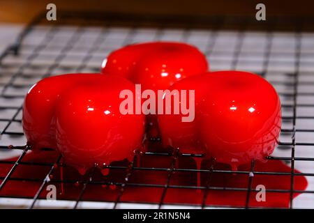 Mousse Cake Red prepare French mousse cakes with mirror glaze. Modern european dessert. High quality 4k footage Stock Photo