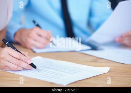 Business people, hands and writing on spreadsheet for finance paperwork or budget expenses on office desk. Hand of accountant team with financial Stock Photo