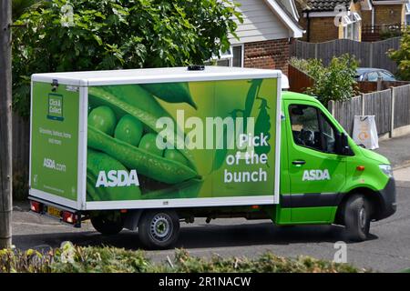 Side & back view Asda supermarket transport van food supply chain retail business online internet grocery shopping after home delivery in UK village Stock Photo