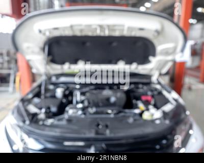 Abstract blur of engine inside bonnet hood car garage automobile ...