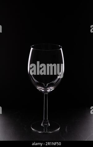 photo of an empty glass glass against a black background Stock Photo
