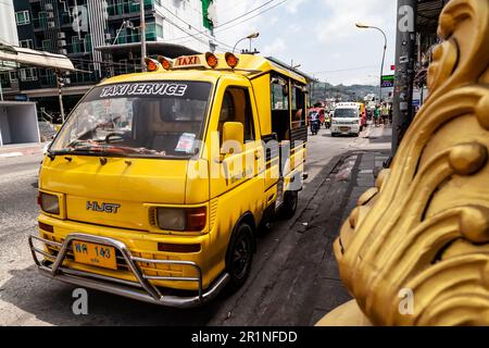 Thailand, Patong - 03.27.23: small Japanese trucks converted into taxis for tourists called tuk tuk in Thailand on the island of Phuket. Multi-colored Stock Photo