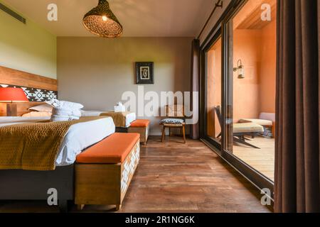 Bedrooms at PAL Savana RESERVE, a safari-like hotel at Le Pal theme park in France. Stock Photo