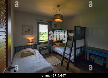 Bedrooms at PAL Savana RESERVE, a safari-like hotel at Le Pal theme park in France. Stock Photo