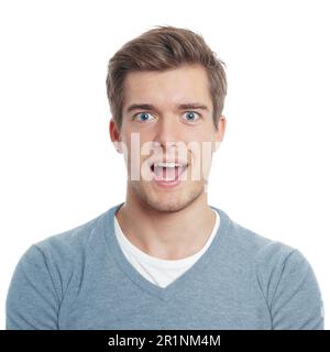 young man looking pleasantly surprised with open mouth Stock Photo