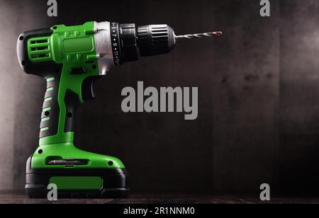 Cordless drill with drill bit working also as screw gun Stock Photo