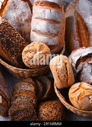 Composition with assorted bakery products in wicker basket Stock Photo
